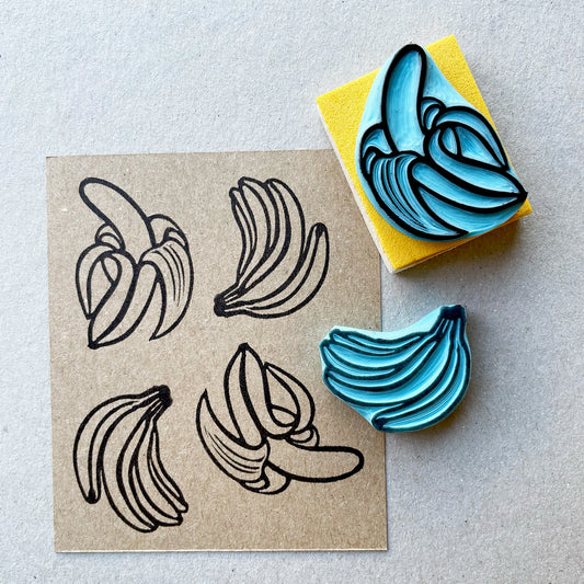 Banana rubber stamps, peeled banana and a banana bunch