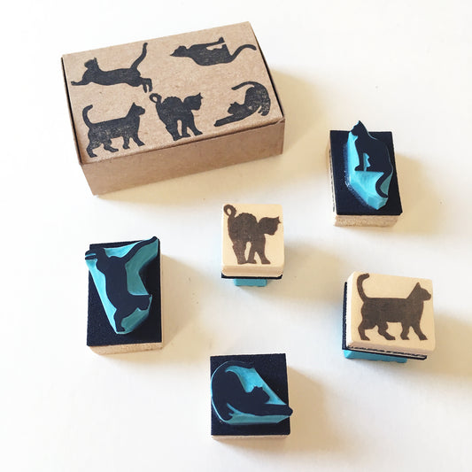 Mini cat stamps set of five next to the cardboard box for git