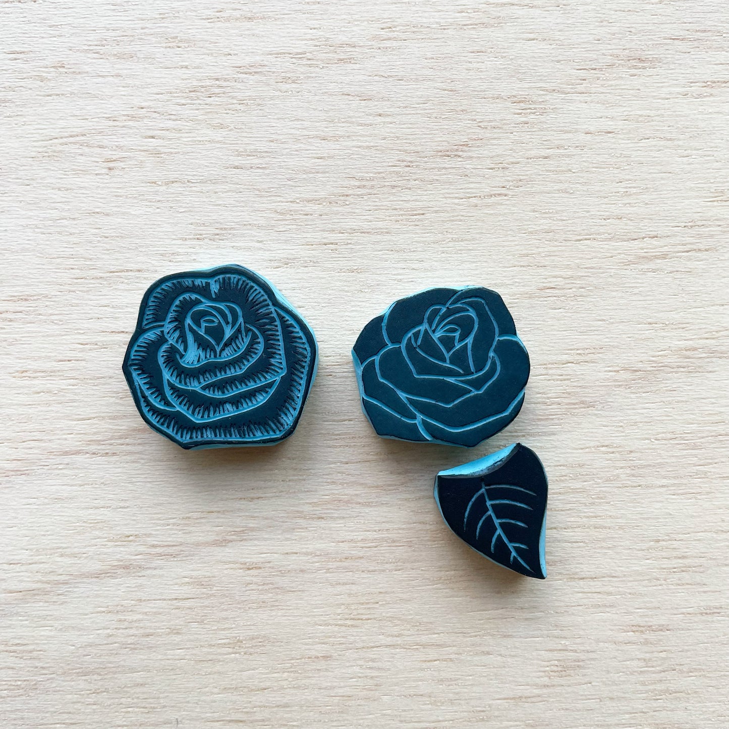 Small rubber stamps of roses and leaf to mix and match