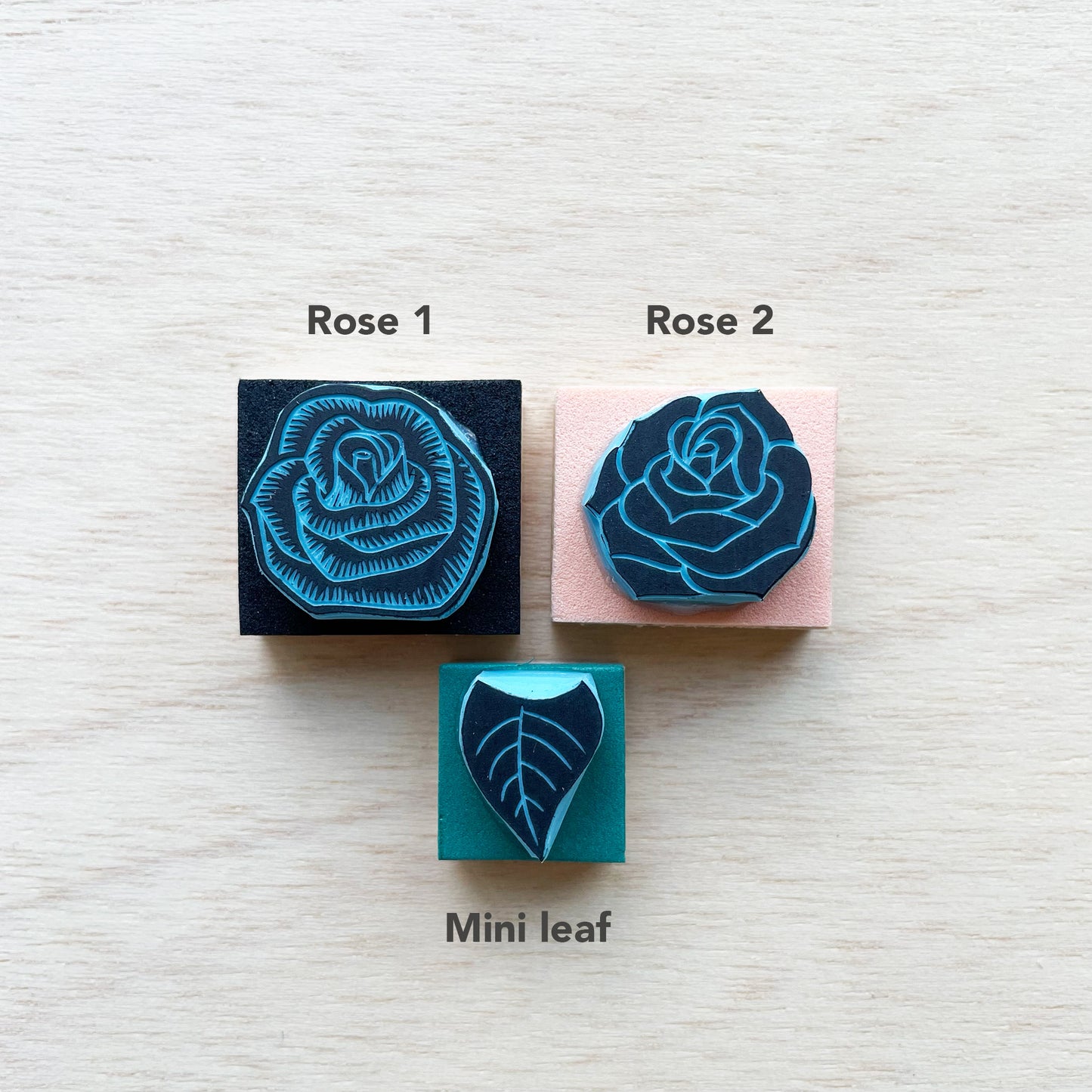 Small rubber stamps of roses and leaf to mix and match