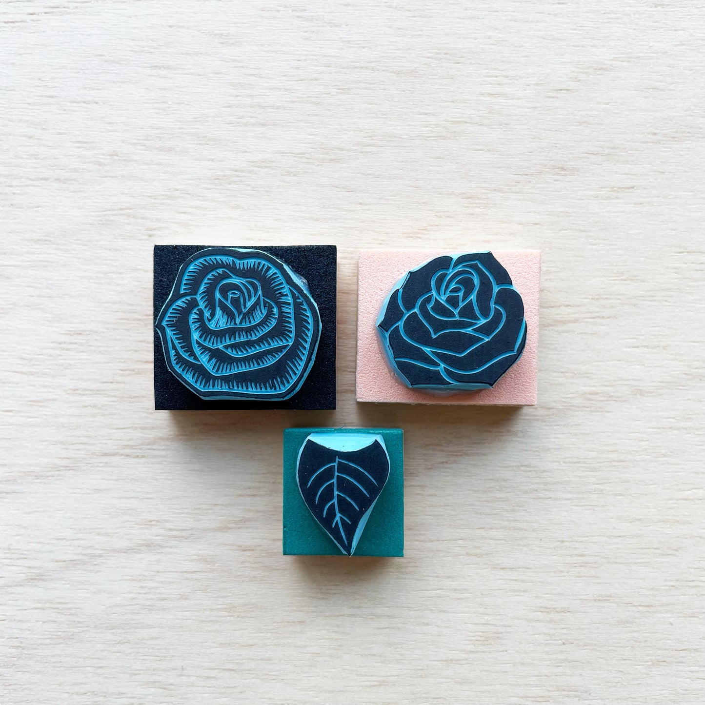 Small rubber stamps of roses and leaf to mix and match