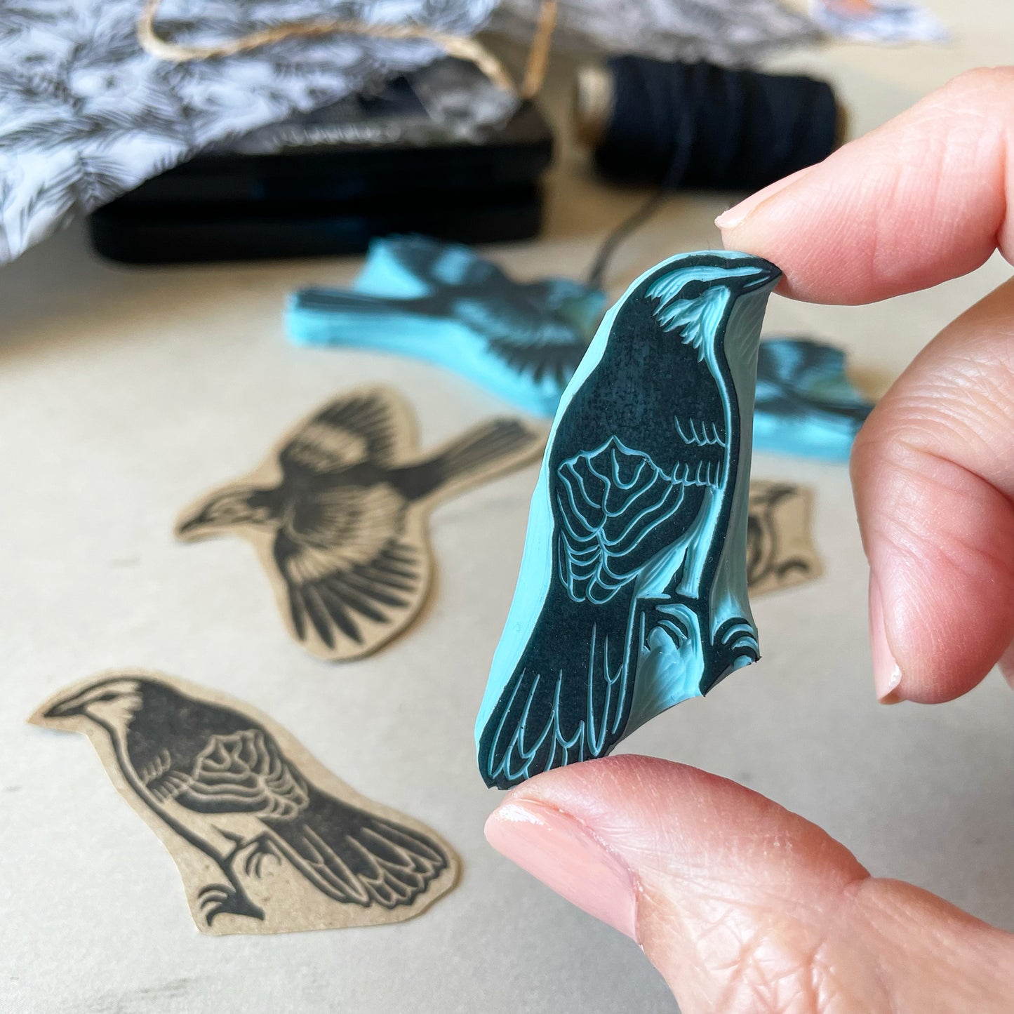 holding a rubber stamp of a bird