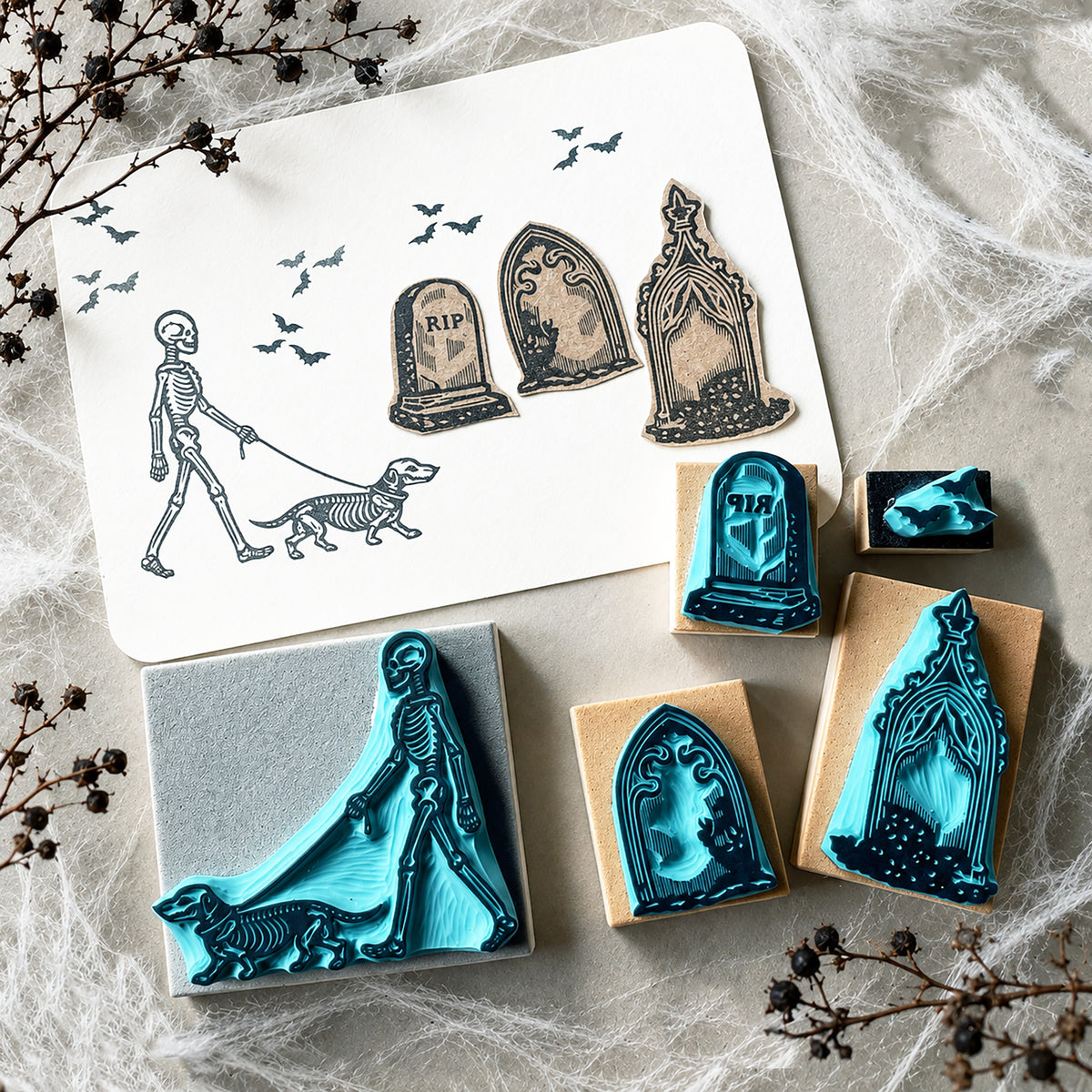 Skeleton walking a dog rubber stamps on a graveyard for Halloween spooky-cute stamping