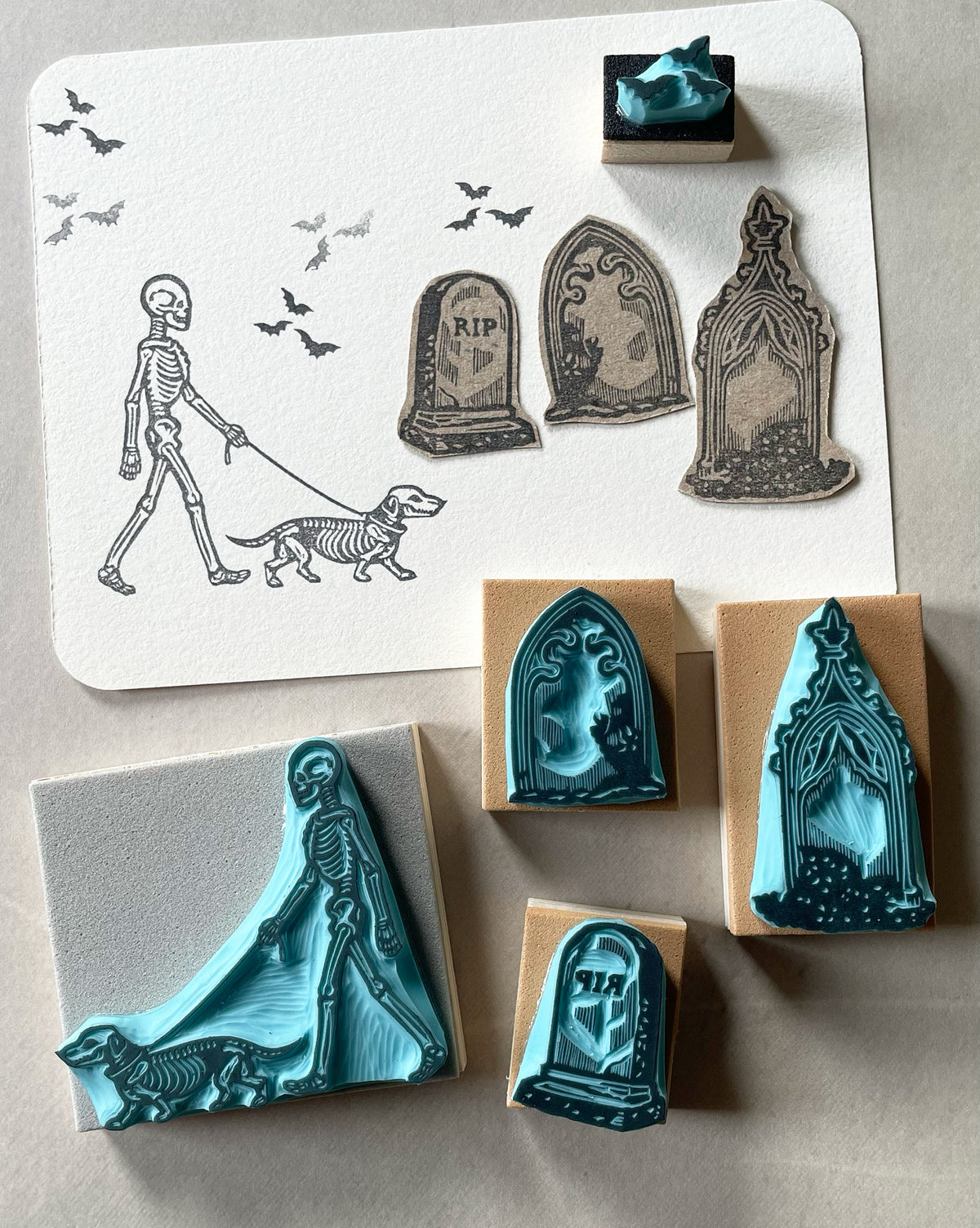 Skeleton walking a dog rubber stamps on a graveyard for Halloween spooky-cute stamping