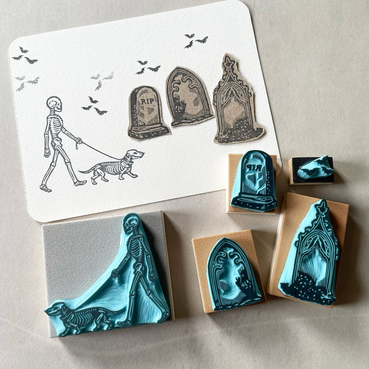 Skeleton walking a dog rubber stamps on a graveyard for Halloween spooky-cute stamping