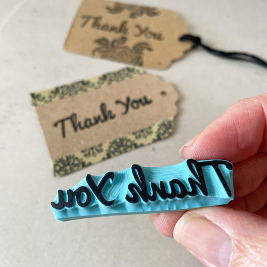 Hand carved rubber stamp of a Thank You word