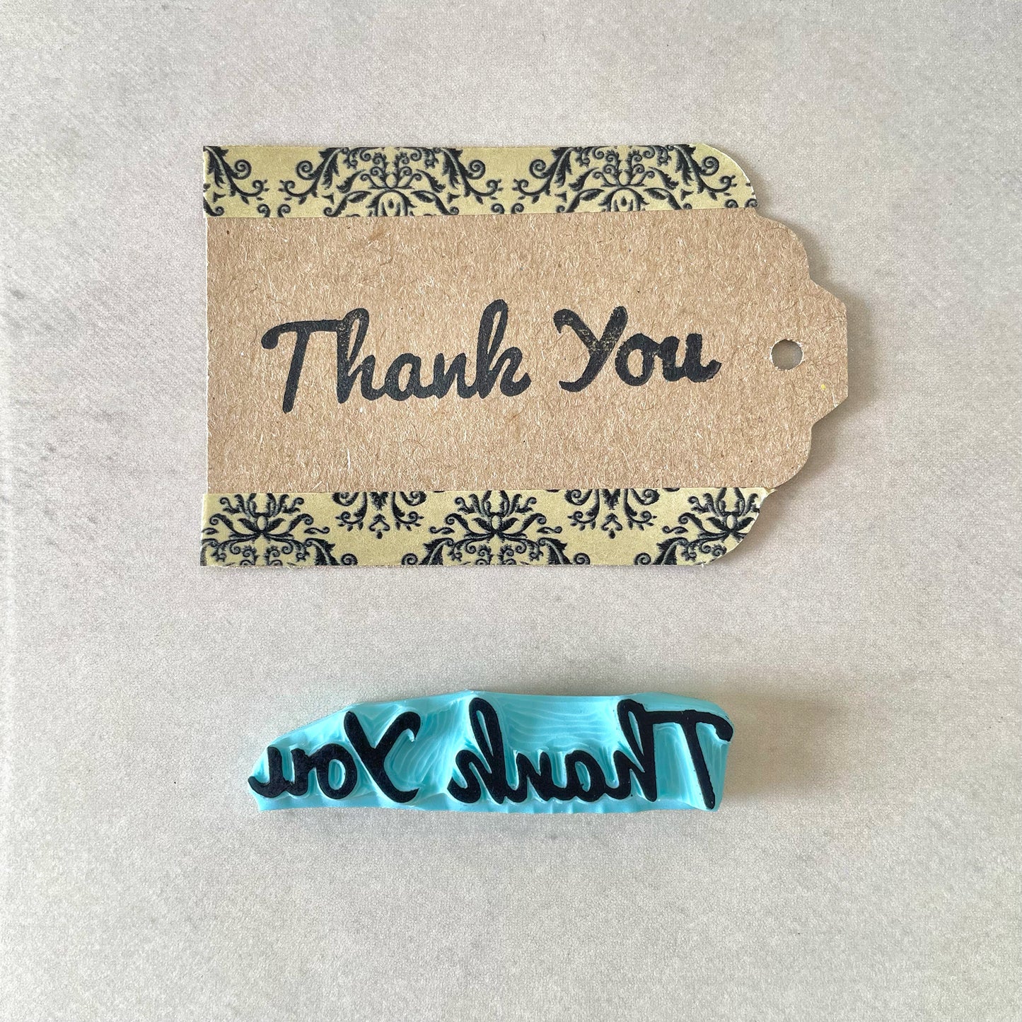 Hand carved rubber stamp of a Thank You word