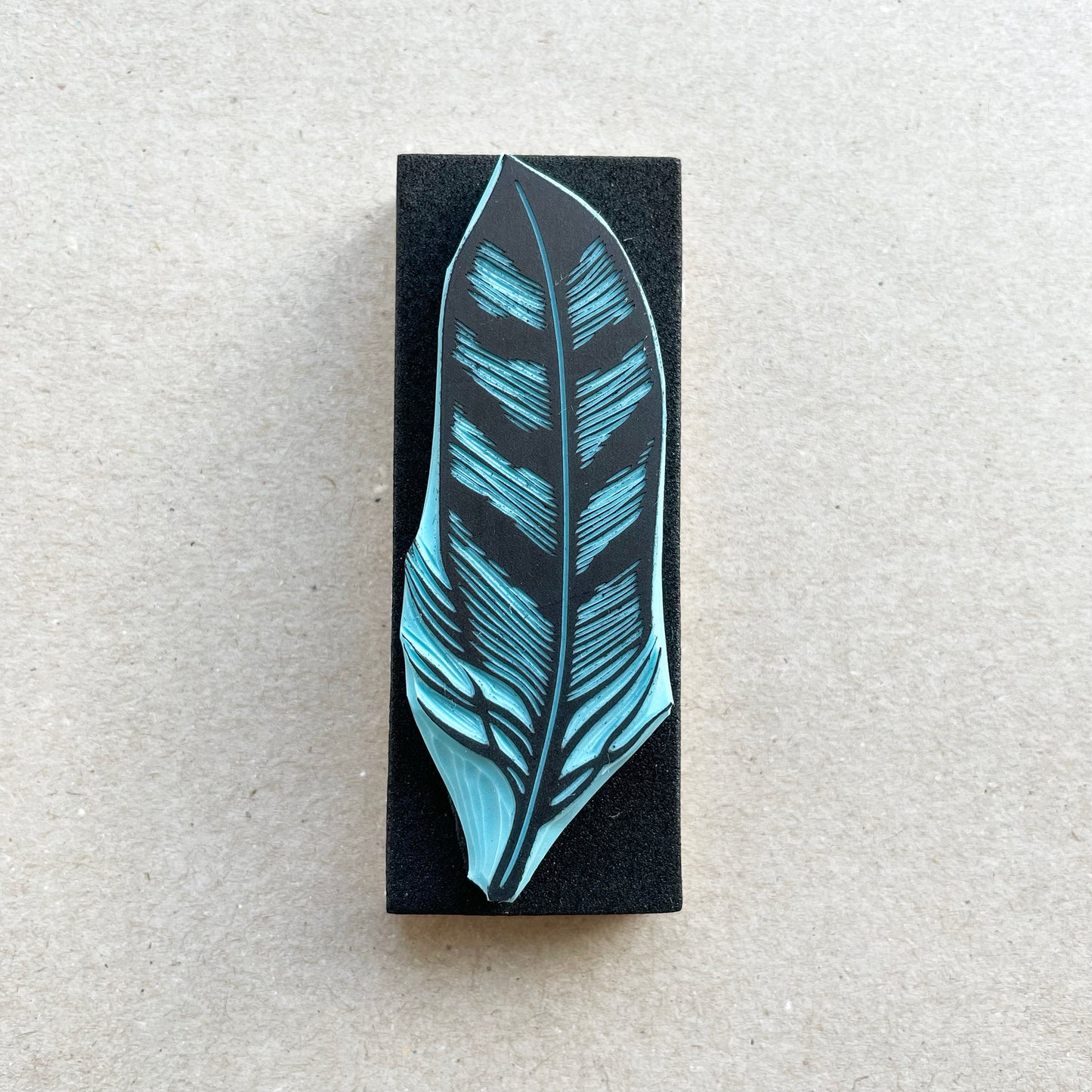 front view of an owl bird feather rubber stamp with wood base